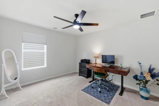 a bathroom with a sink toilet a mirror a vanity and shower