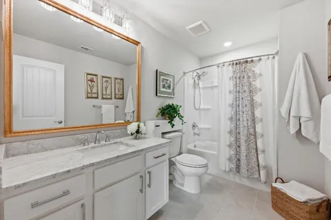 a bedroom with a bed and dresser