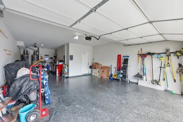 a living room with furniture a flat screen tv and a wooden floor