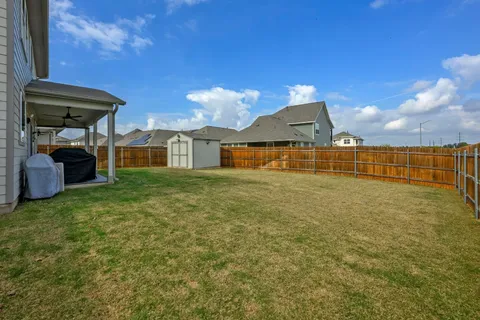 a view of a porch with furniture and garden