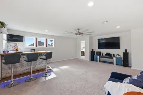 a kitchen with stainless steel appliances granite countertop a refrigerator stove a sink dishwasher and a microwave with wooden cabinets