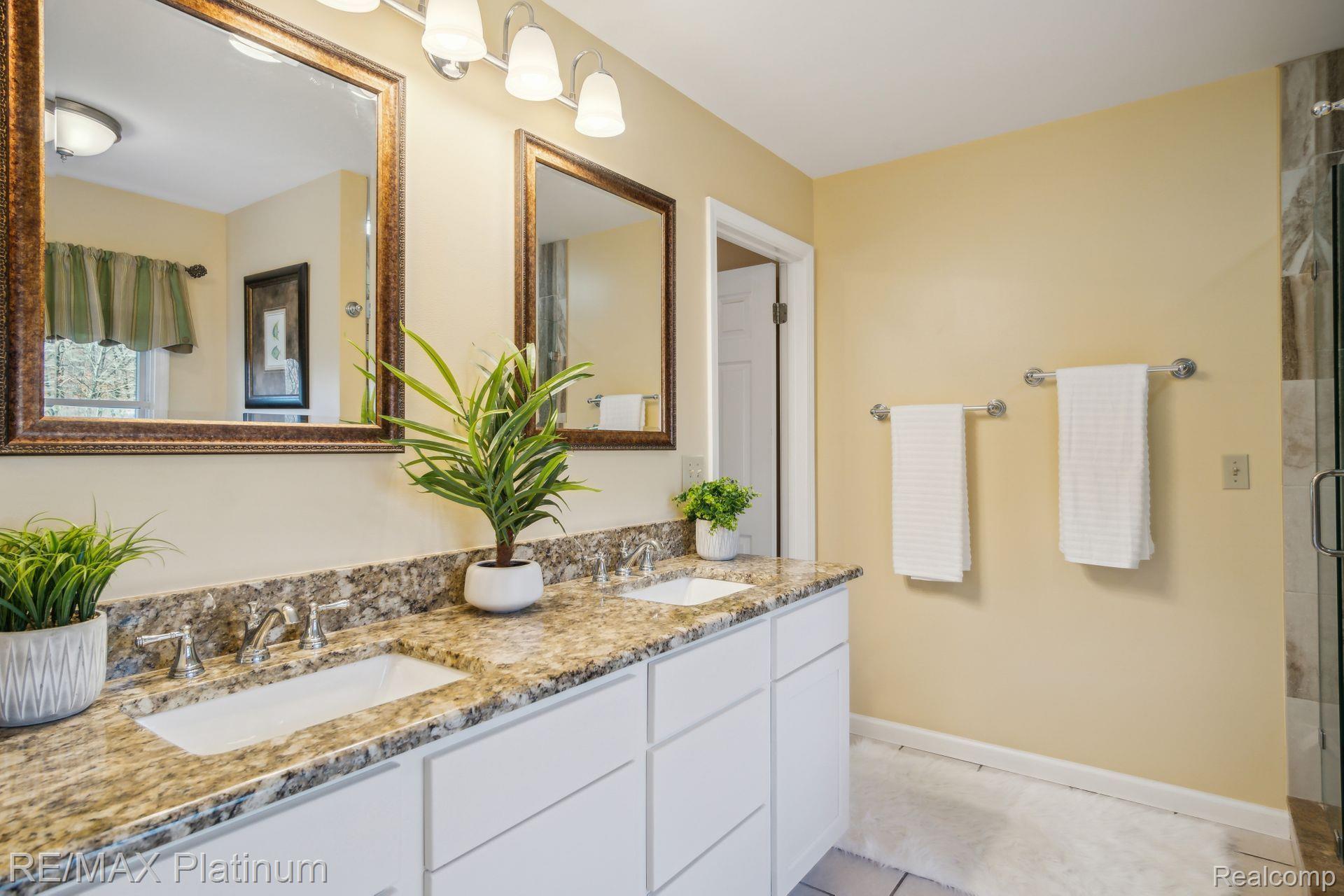 440 Gulley Road Howell, MI 48843 - Photo 21 of 50 Dual sinks, stand up shower, and tub
