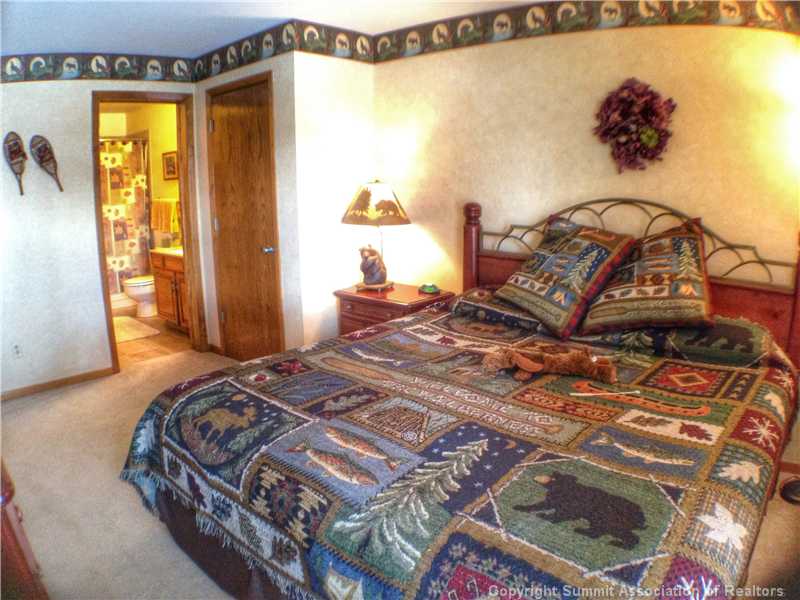 89310 Ryan Gulch Road, Unit 101 Silverthorne, CO 80498 - Photo 11 of 25 Master Bedroom.