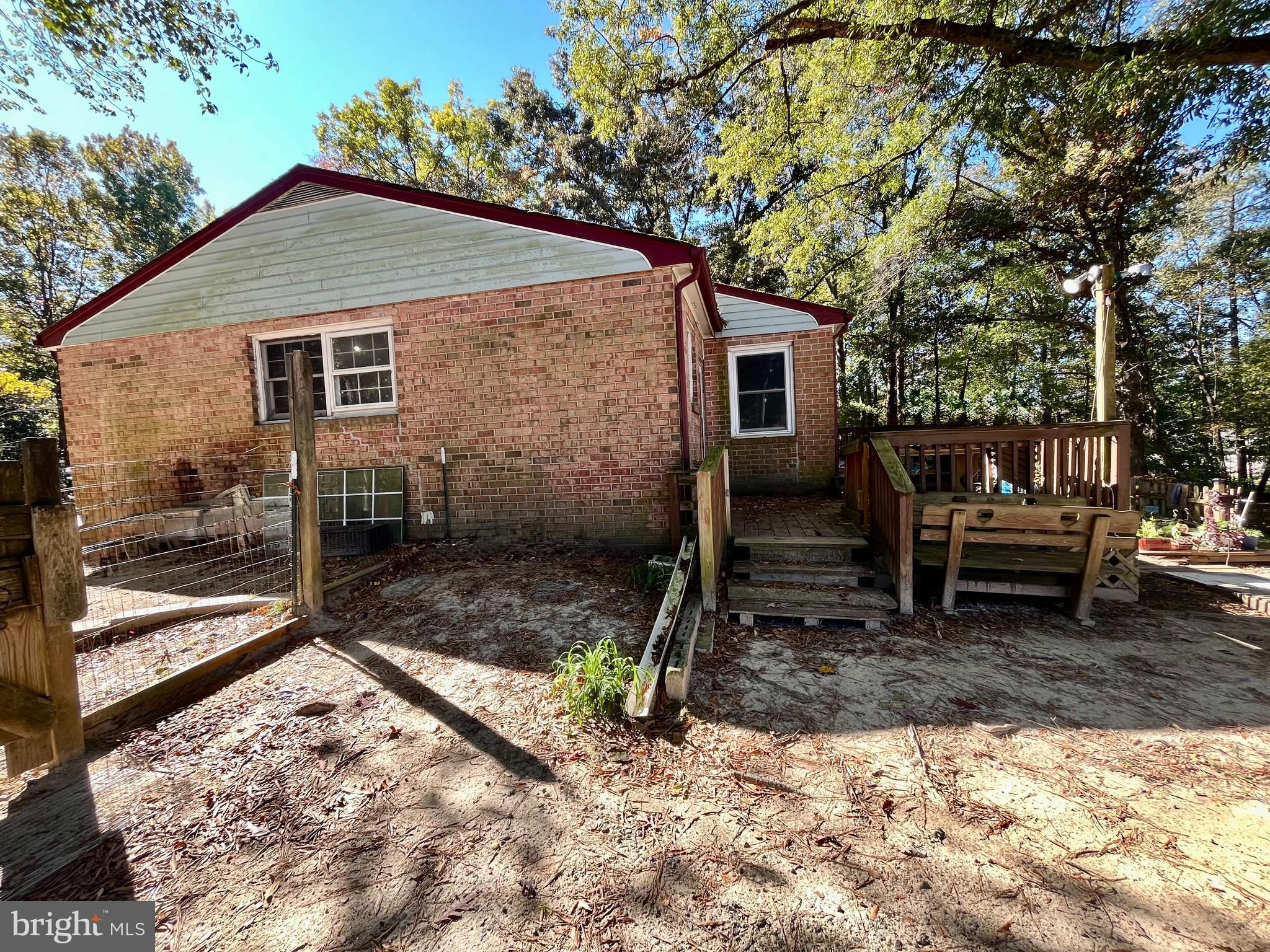 4302 Baxter Road Prince George, VA 23875 - Photo 13 of 78 a backyard of a house with barbeque oven table and chairs