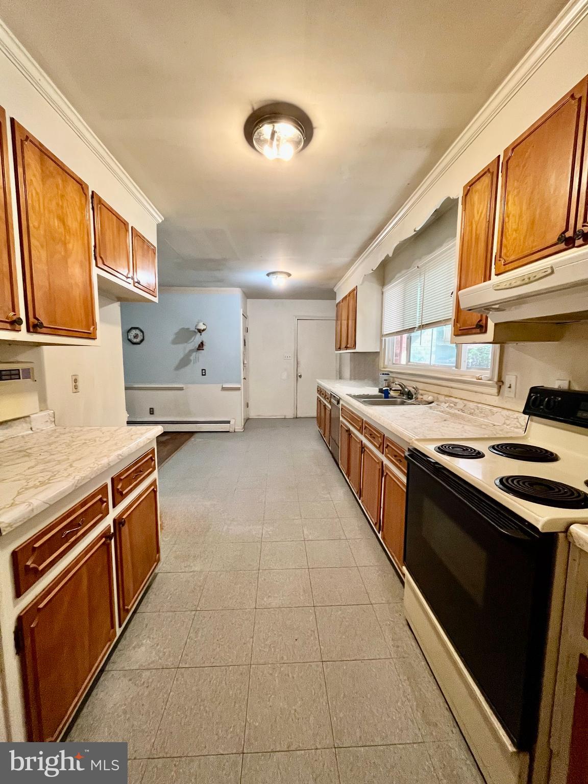 4302 Baxter Road Prince George, VA 23875 - Photo 28 of 78 a kitchen with stainless steel appliances granite countertop a stove and a sink