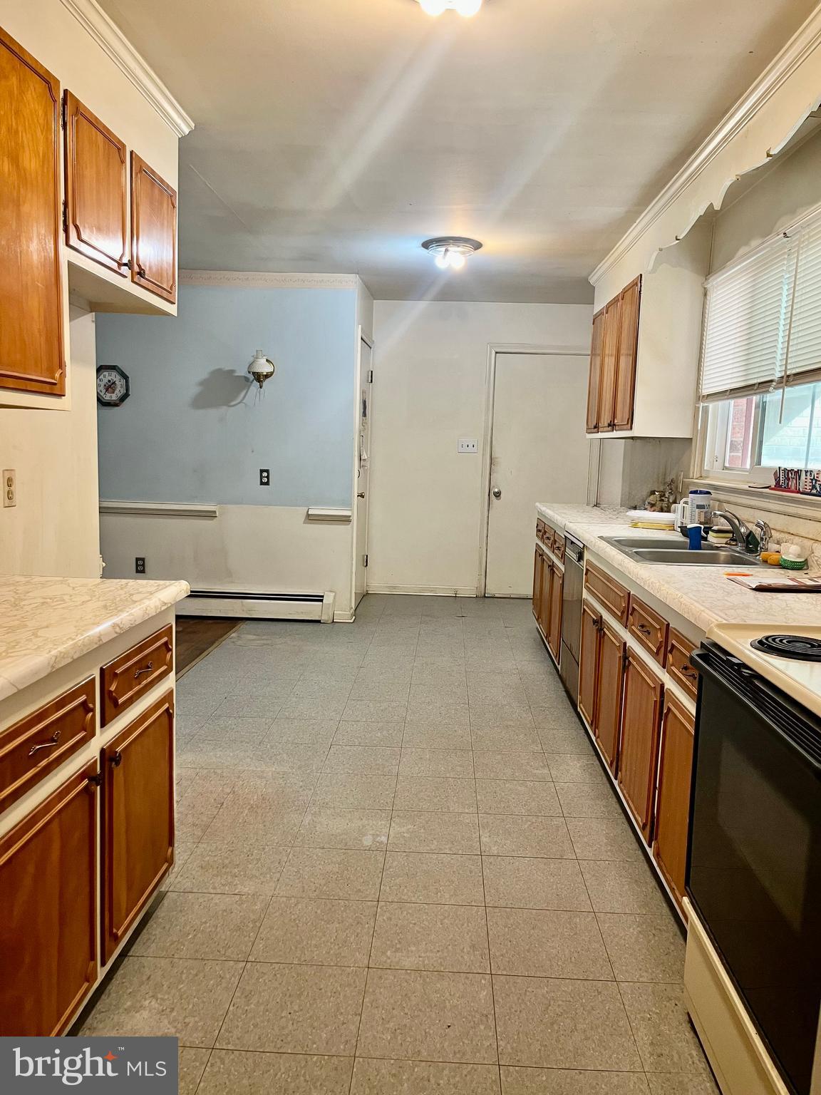 4302 Baxter Road Prince George, VA 23875 - Photo 29 of 78 a kitchen with stainless steel appliances a sink stove and cabinets