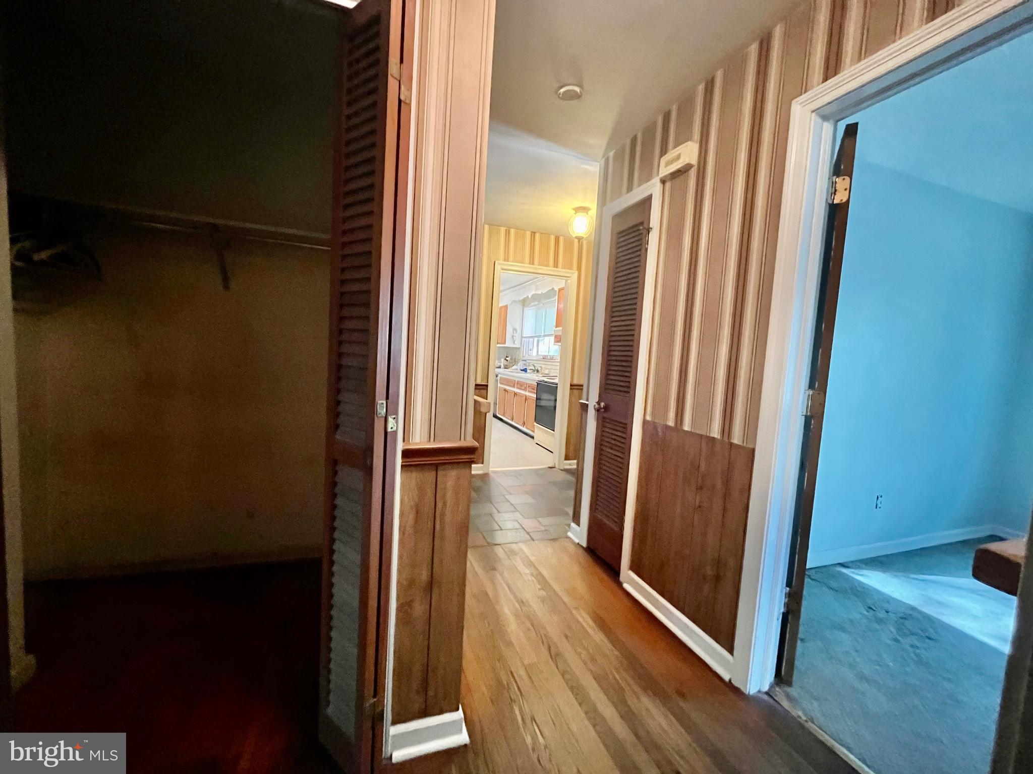 4302 Baxter Road Prince George, VA 23875 - Photo 30 of 78 a view of a hallway with wooden floor and staircase