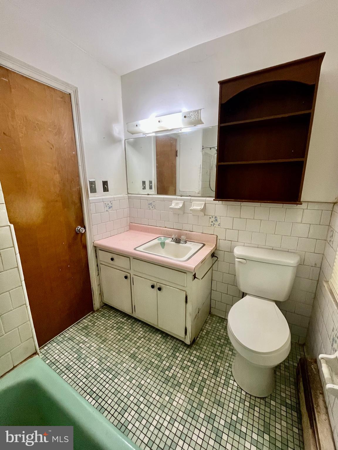 4302 Baxter Road Prince George, VA 23875 - Photo 37 of 78 a bathroom with a sink a toilet and mirror
