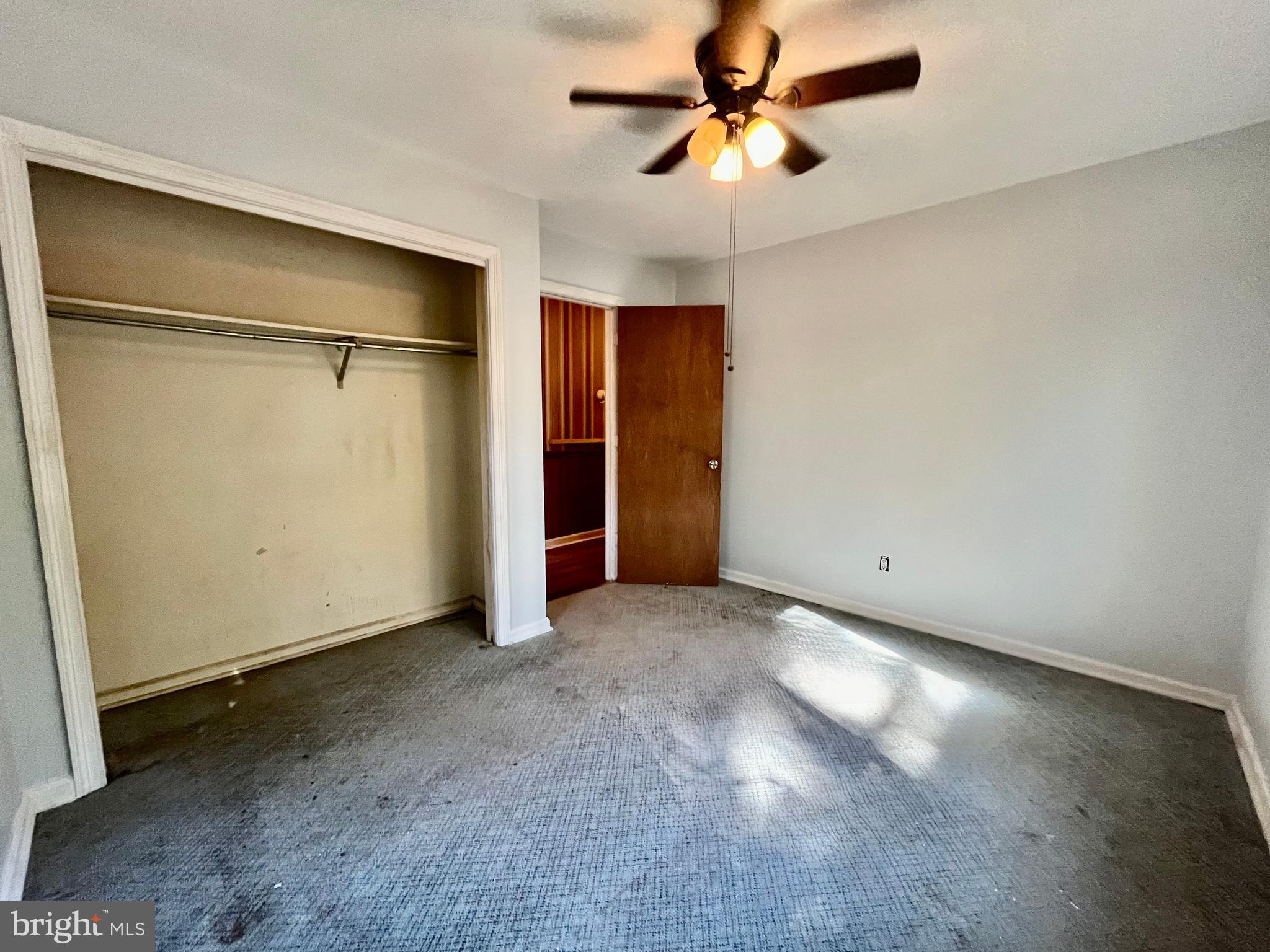 4302 Baxter Road Prince George, VA 23875 - Photo 42 of 78 an empty room with closet and a ceiling fan