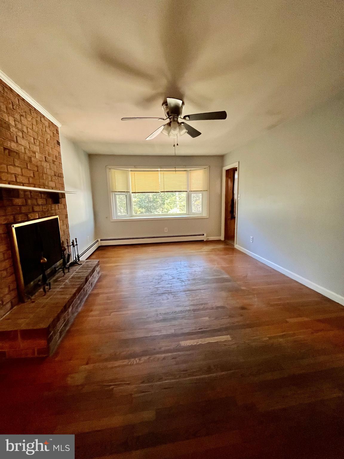 4302 Baxter Road Prince George, VA 23875 - Photo 47 of 78 a view of an empty room with a fireplace and a window