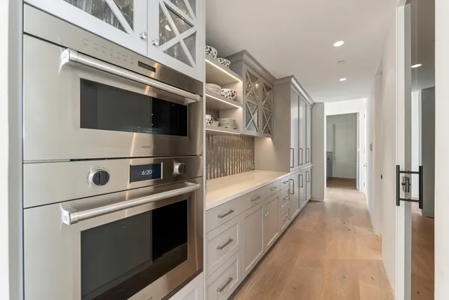 a bed sitting in a bedroom next to a large window