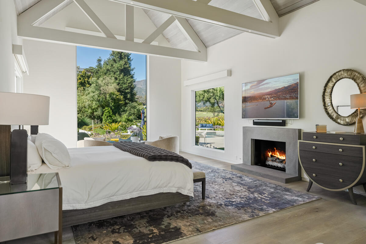 1850 Jelinda Drive Montecito, CA 93108 - Photo 26 of 50 a bedroom with a bed and a fireplace