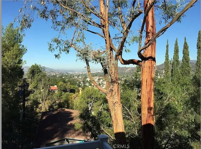 a view of mountain view with lots of trees