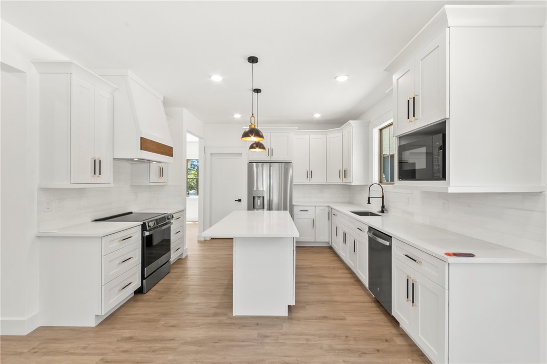 230 Hammond Circle Anderson, SC 29621 - Photo 8 of 48 This spacious kitchen offers a blend of style and functionality, perfect for culinary adventures.