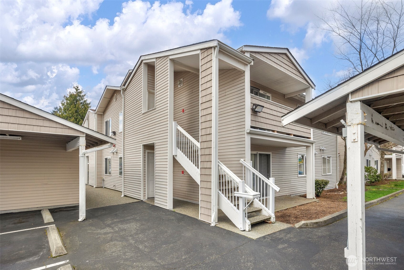 1001 West Casino Road, Unit B101 Everett, WA 98204 - Photo 1 of 19 a view of a house with a yard