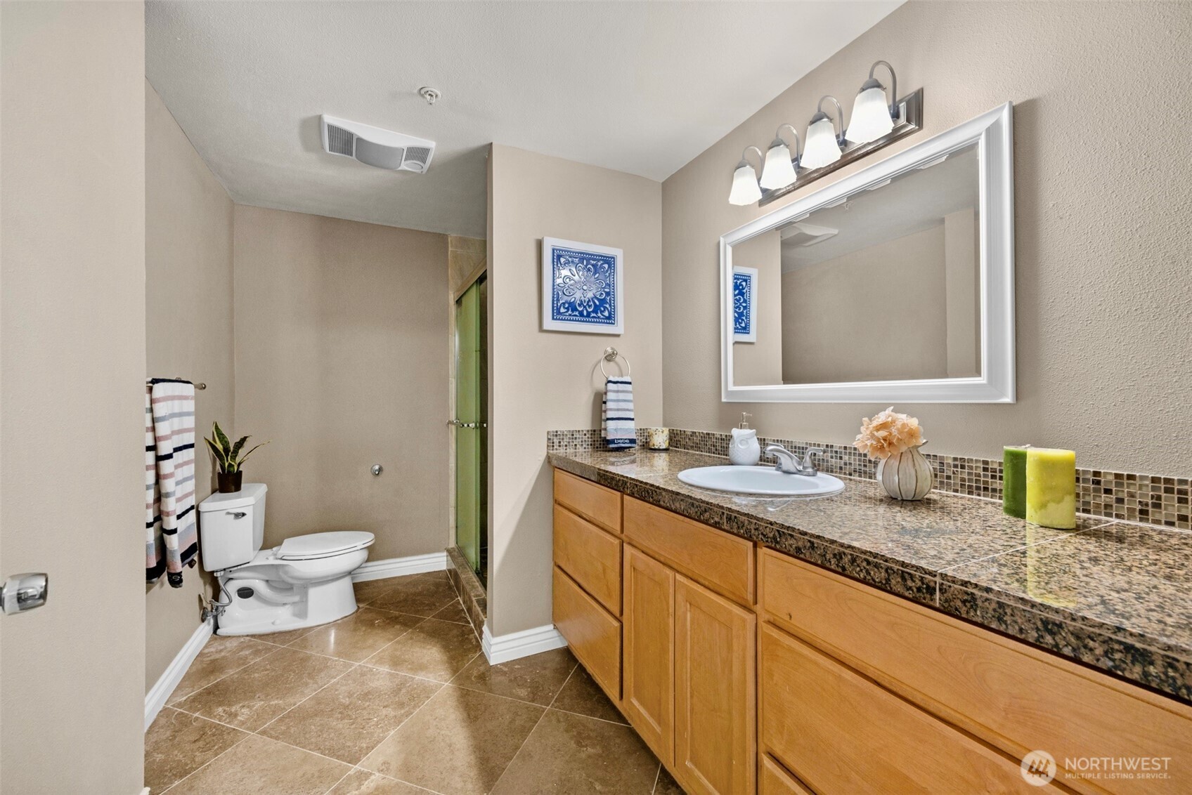 1001 West Casino Road, Unit B101 Everett, WA 98204 - Photo 13 of 19 a bathroom with a granite countertop sink mirror and toilet