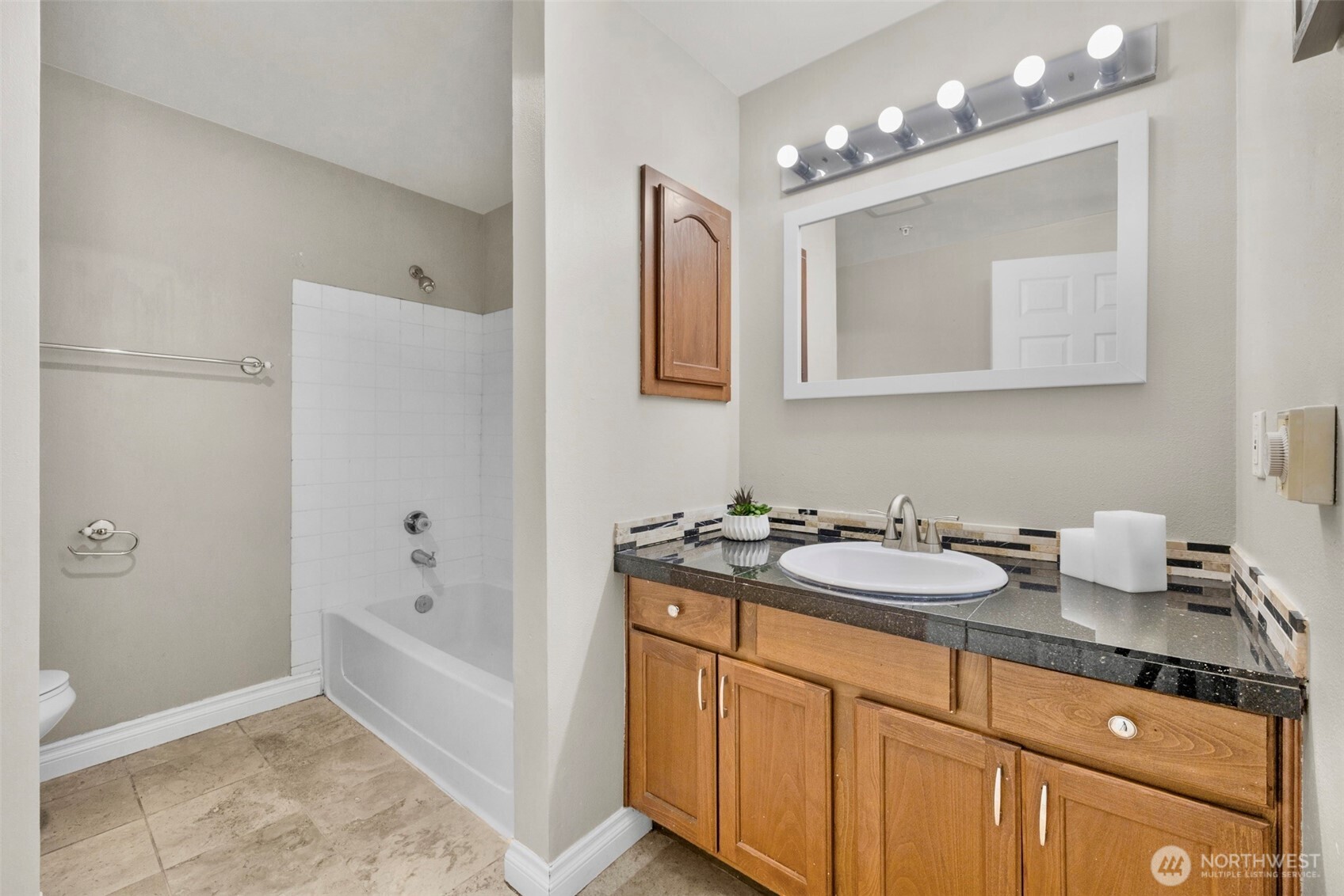 1001 West Casino Road, Unit B101 Everett, WA 98204 - Photo 16 of 19 a spacious bathroom with a sink double vanity granite and a mirror