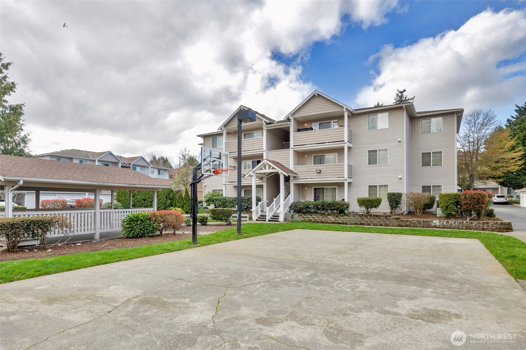 1001 West Casino Road, Unit B101 Everett, WA 98204 - Photo 19 of 19 a front view of multiple houses with yard and green space