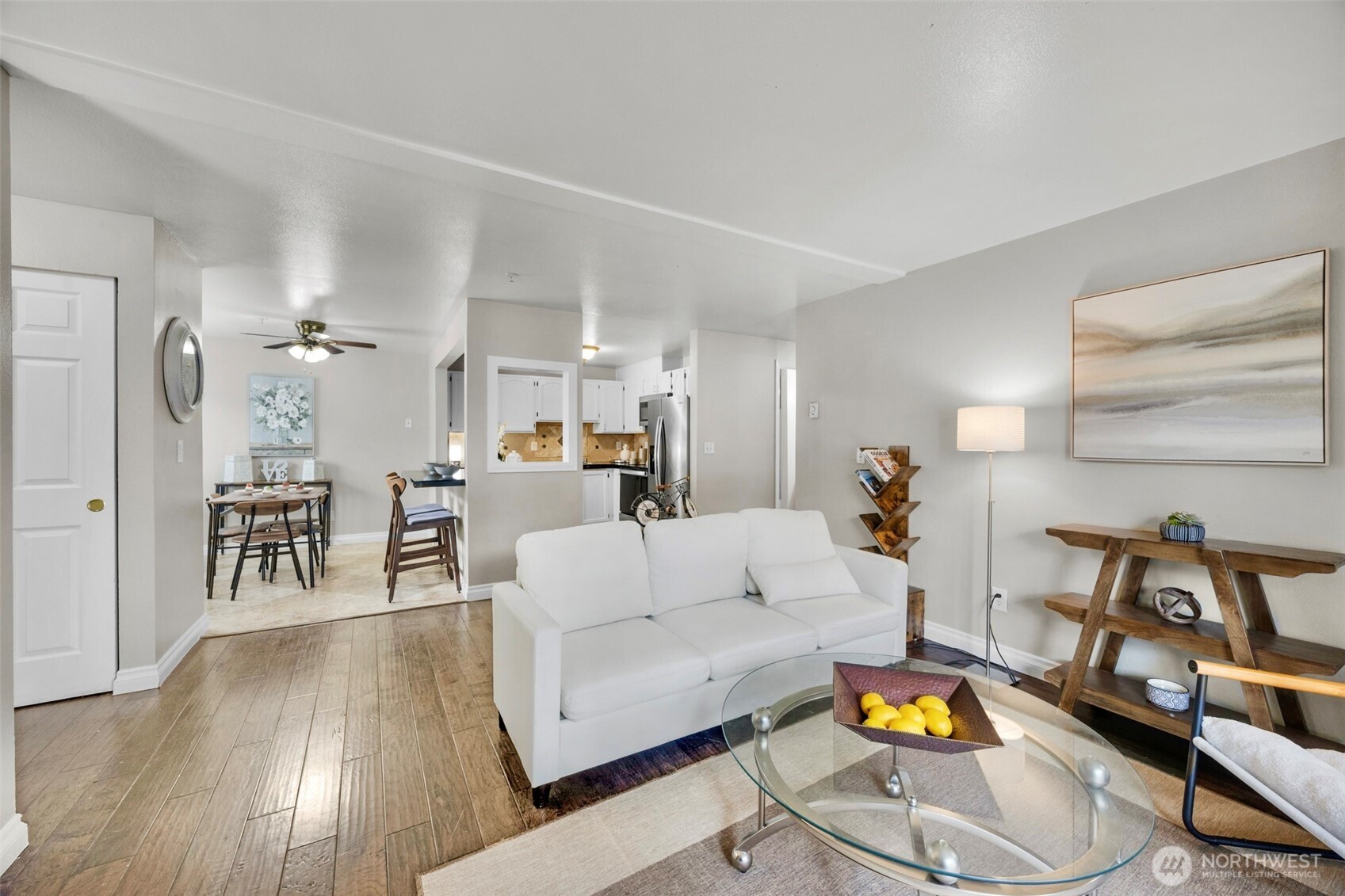 1001 West Casino Road, Unit B101 Everett, WA 98204 - Photo 3 of 19 a living room with furniture and wooden floor