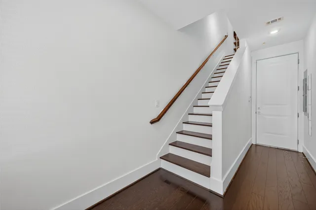 a white toilet sitting next to a bathroom sink