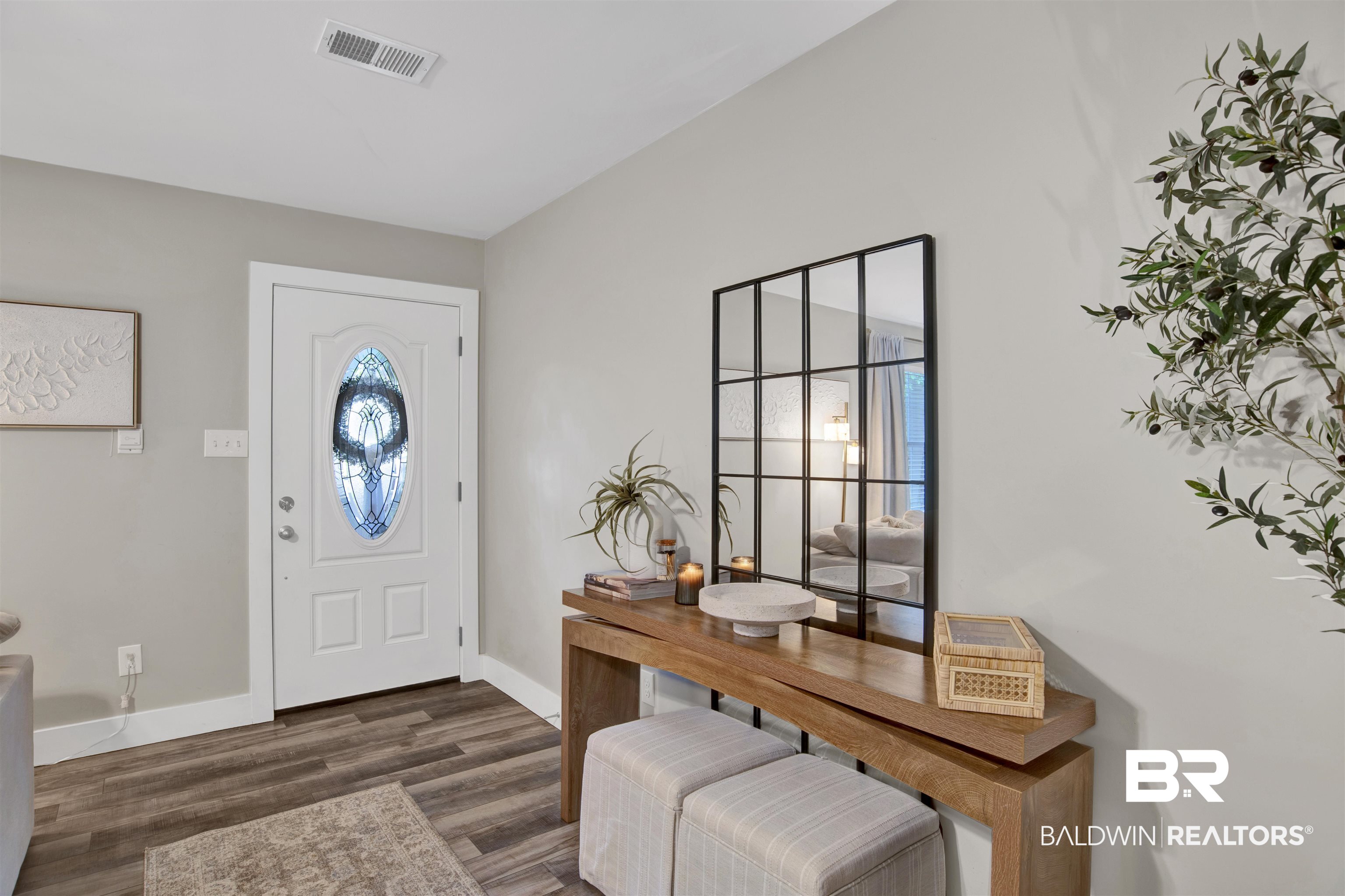 253 Maplewood Loop Daphne, AL 36526 - Photo 17 of 30 Entryway featuring a white door with an oval stained-glass insert, wood-finish flooring, and light grey wall paint