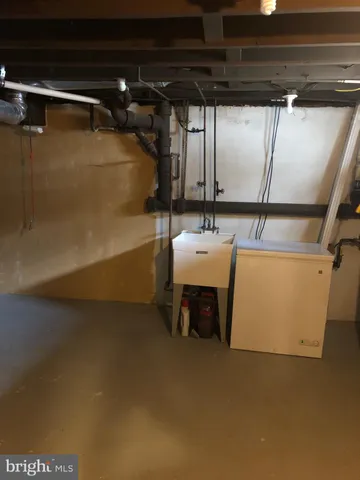 a view of a house with a small yard and a large window