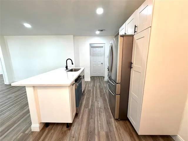 a hallway with washer and dryer