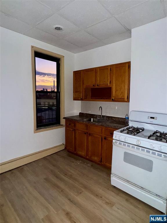 108 32nd Street Union City, NJ 07087 - Photo 3 of 10 a kitchen with stainless steel appliances a stove and a microwave