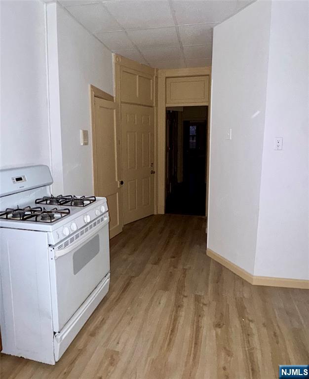 108 32nd Street Union City, NJ 07087 - Photo 4 of 10 a kitchen with a stove and a refrigerator
