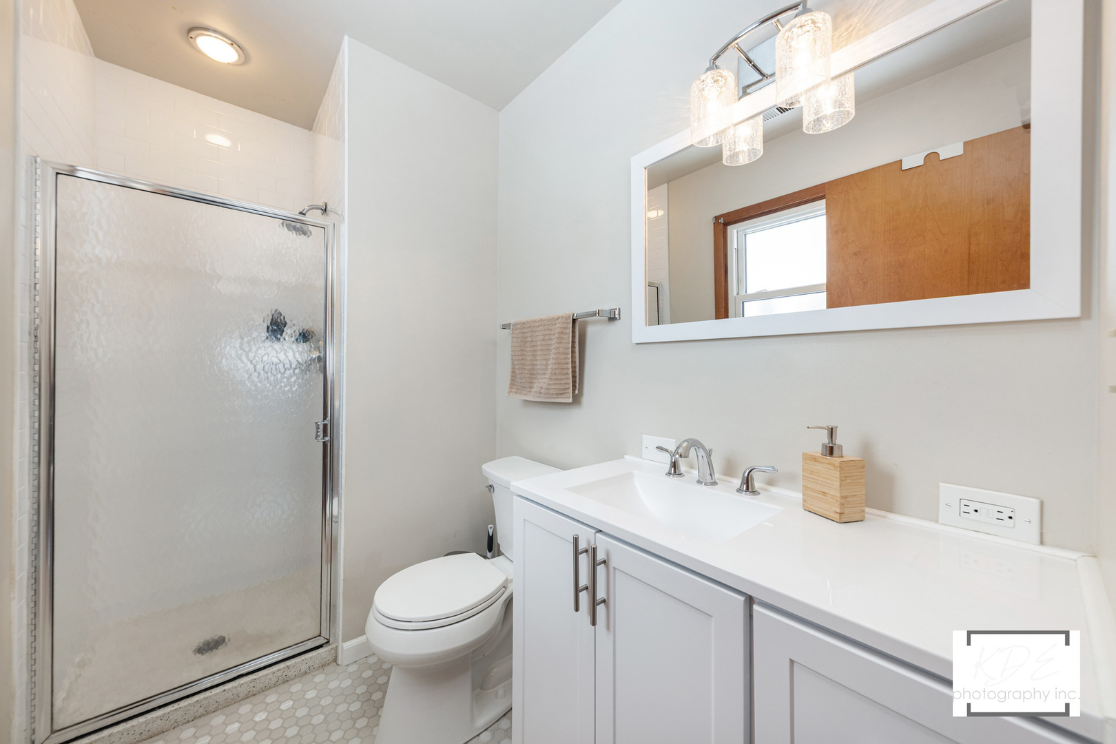 1236 Hercules Lane Naperville, IL 60540 - Photo 18 of 41 a bathroom with a sink a mirror a toilet and shower