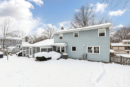 1236 Hercules Lane Naperville, IL 60540 - Photo 32 of 41 a front view of a house with a yard covered in snow