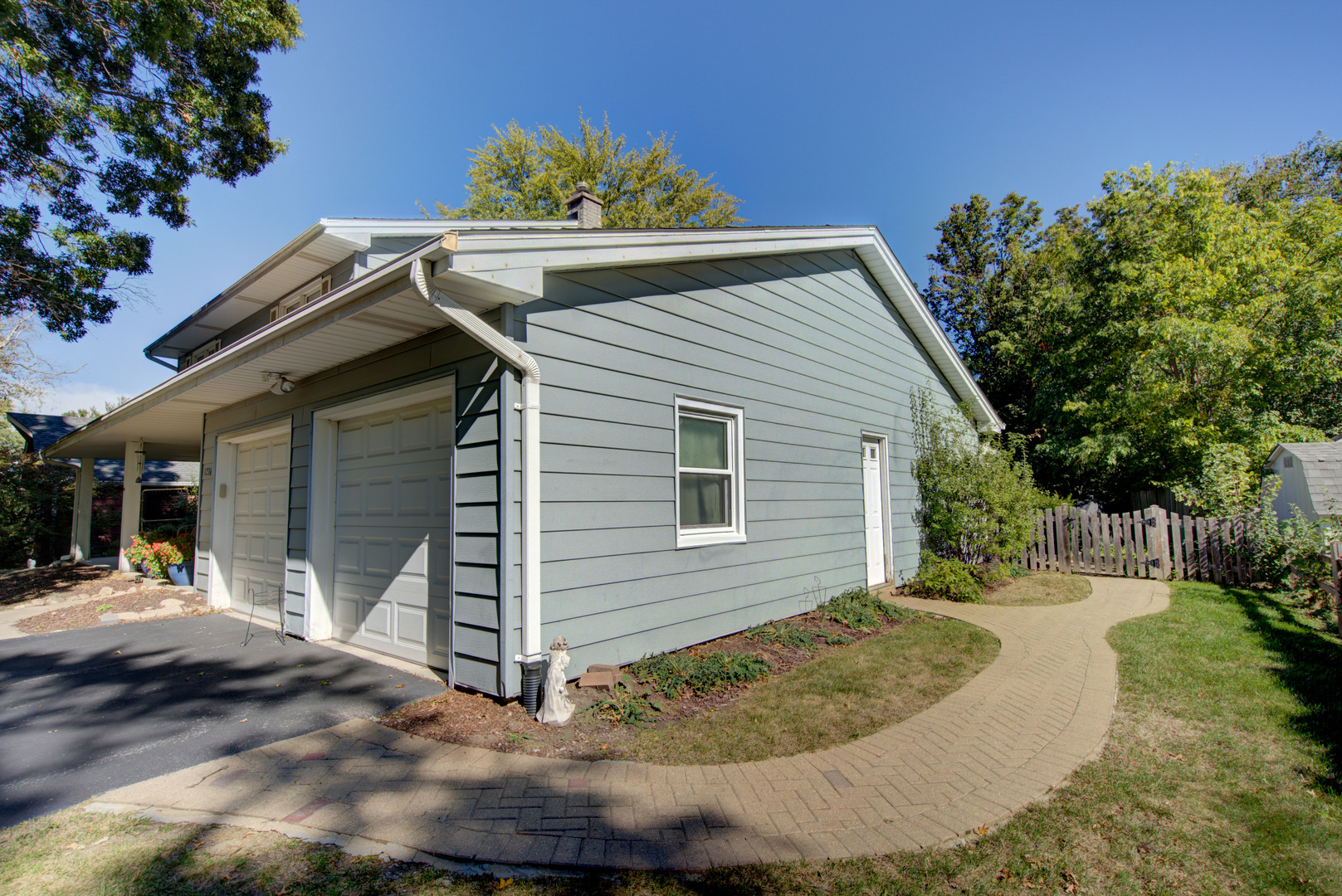 1236 Hercules Lane Naperville, IL 60540 - Photo 38 of 41 a view of a house with a small yard and potted plants