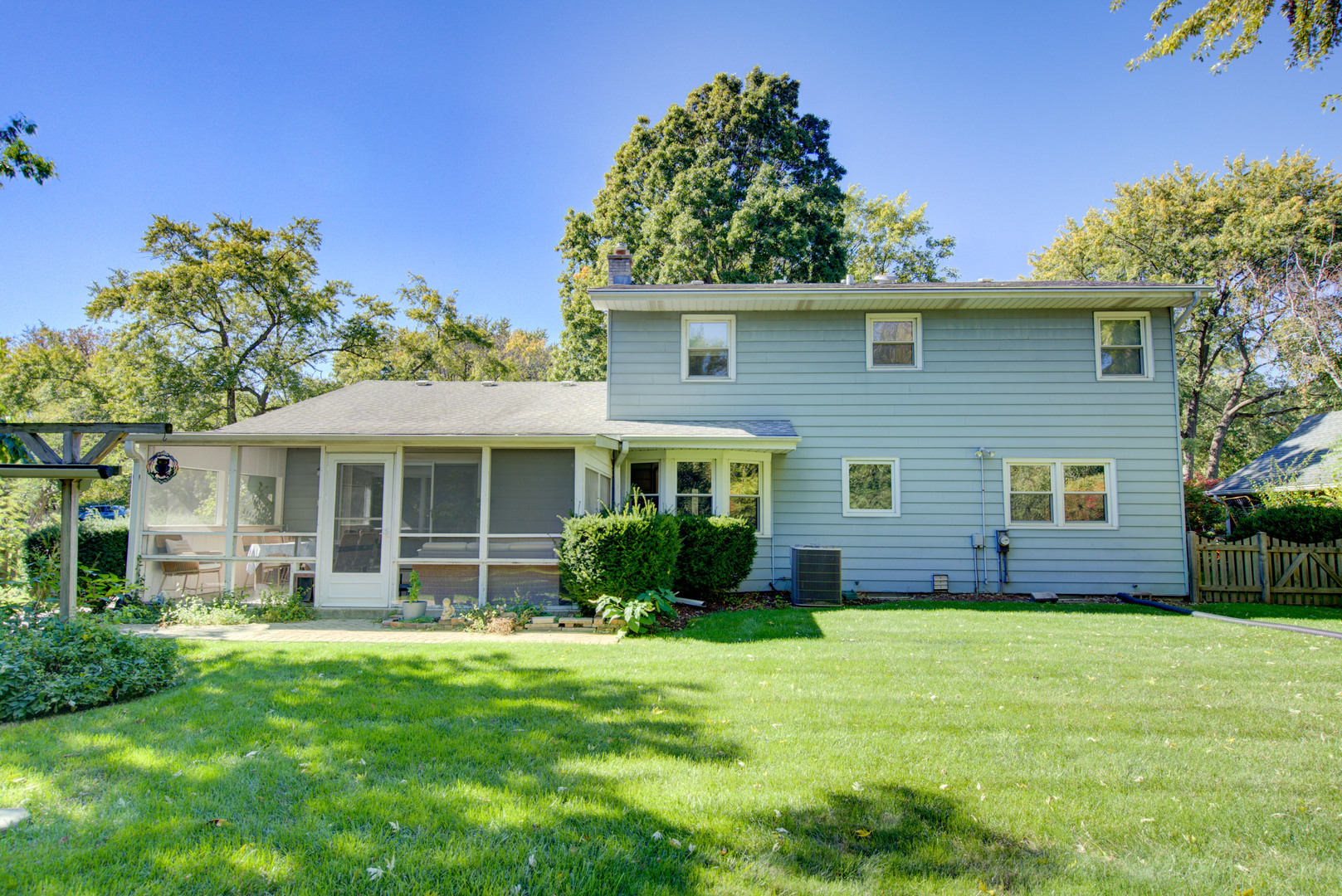 1236 Hercules Lane Naperville, IL 60540 - Photo 40 of 41 a view of a house with a yard and potted plants