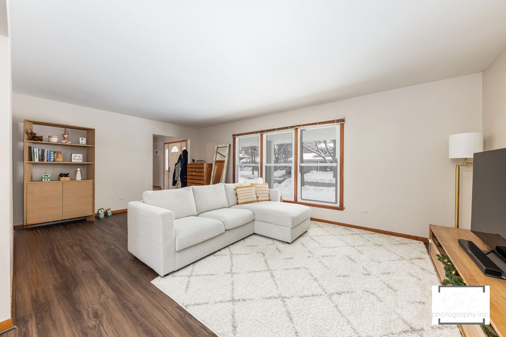 1236 Hercules Lane Naperville, IL 60540 - Photo 6 of 41 a living room with furniture a flat screen tv and a window