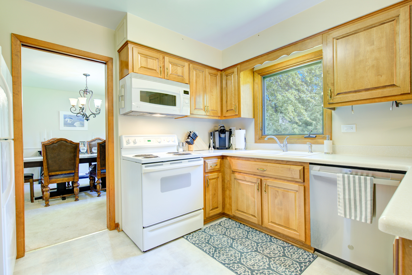 1236 Hercules Lane Naperville, IL 60540 - Photo 9 of 41 a kitchen with a sink cabinets and window