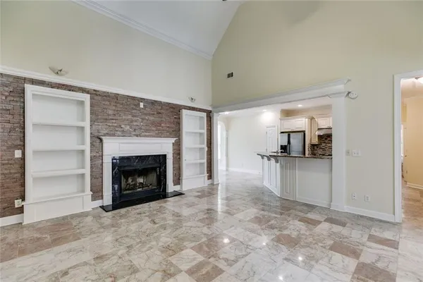 a kitchen with granite countertop a sink stove and cabinets