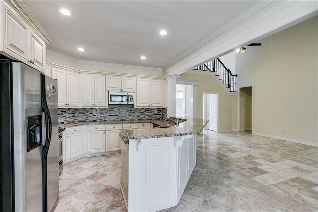 110 Pond View Point LaGrange, GA 30240 - Photo 13 of 65 a kitchen with stainless steel appliances granite countertop a refrigerator a stove and a sink