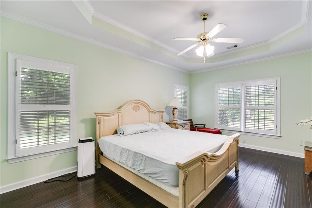 110 Pond View Point LaGrange, GA 30240 - Photo 25 of 65 a bed sitting in a bedroom next to a window