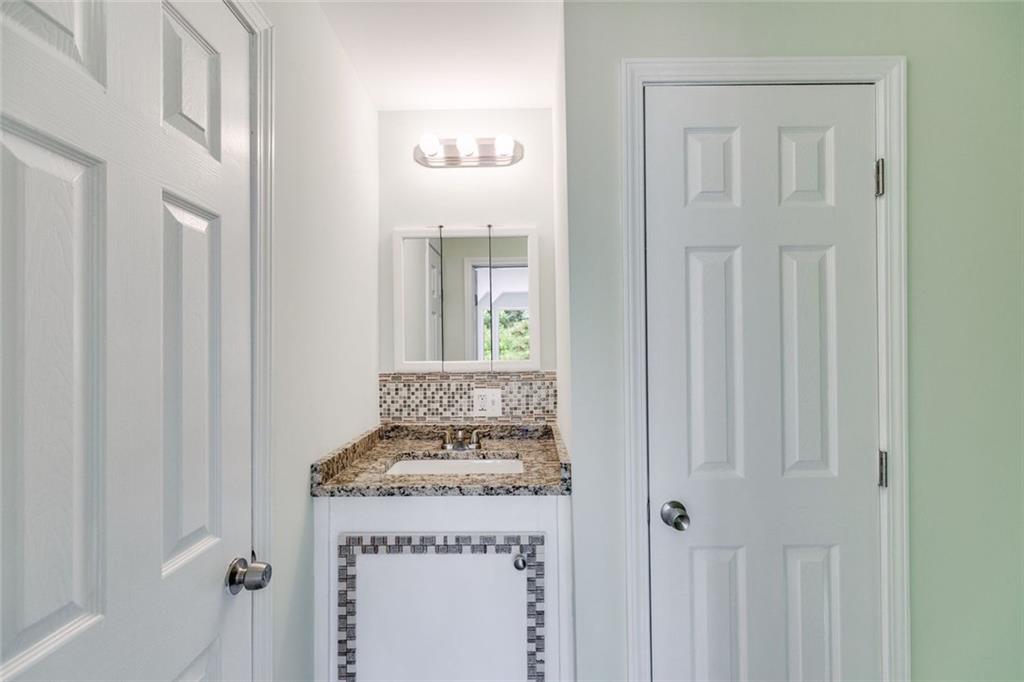 110 Pond View Point LaGrange, GA 30240 - Photo 39 of 65 a bathroom with a granite countertop sink and a mirror
