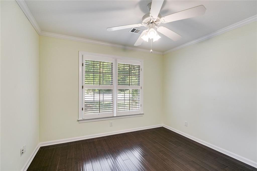 110 Pond View Point LaGrange, GA 30240 - Photo 42 of 65 an empty room with wooden floor and windows