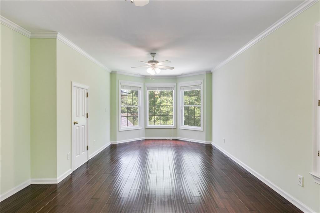 110 Pond View Point LaGrange, GA 30240 - Photo 43 of 65 a view of an empty room with wooden floor and a window