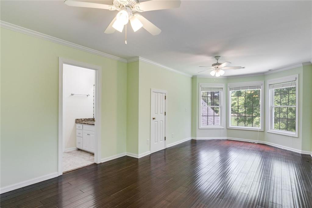 110 Pond View Point LaGrange, GA 30240 - Photo 46 of 65 a view of an empty room with wooden floor and a window