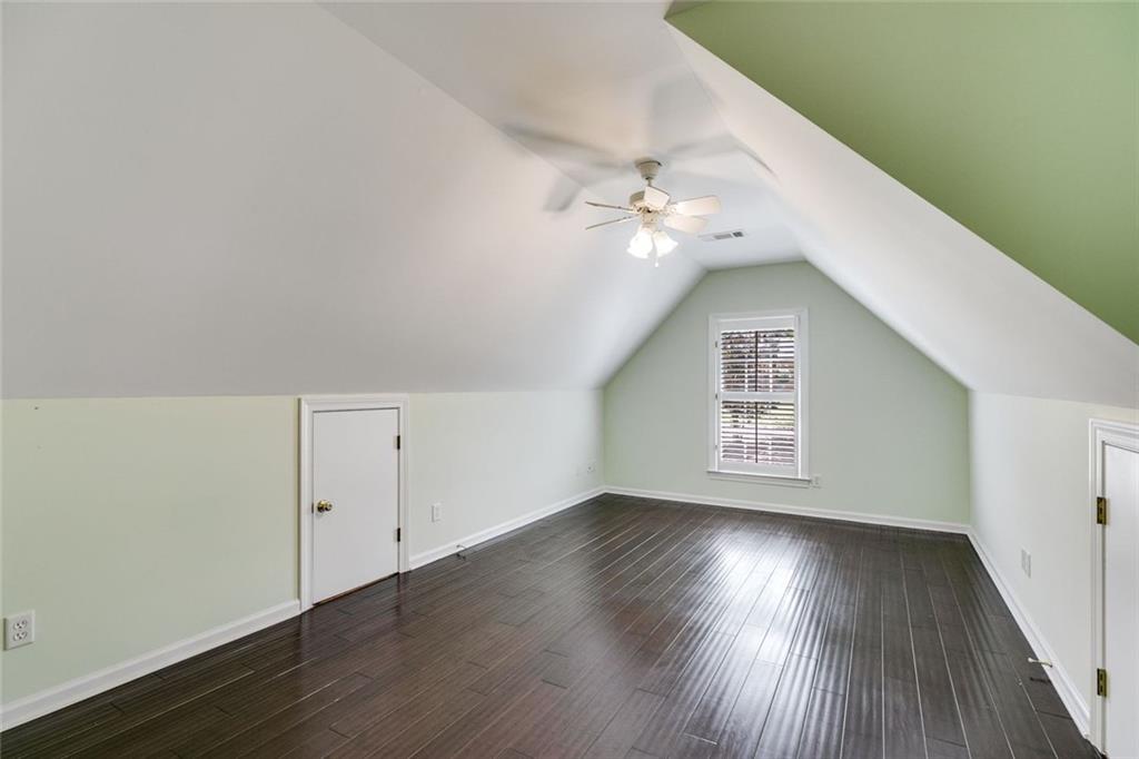 110 Pond View Point LaGrange, GA 30240 - Photo 50 of 65 an empty room with wooden floor fan and windows