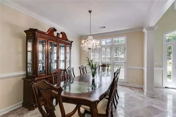 a view of a dining room with furniture window and outside view