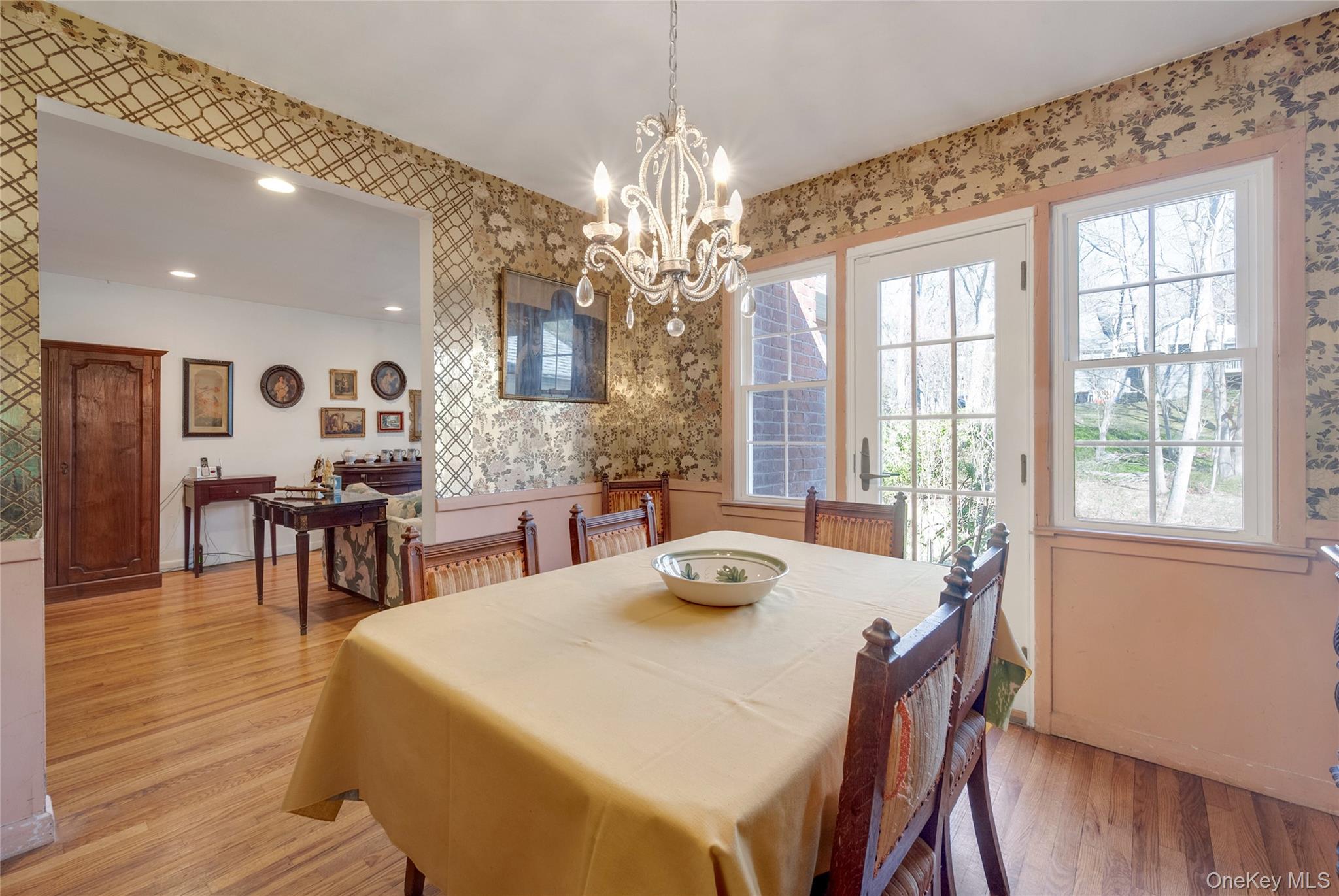 119 Goldens Bridge Road Katonah, NY 10536 - Photo 11 of 34 a dining room with wooden floor a chandelier a wooden table and chairs