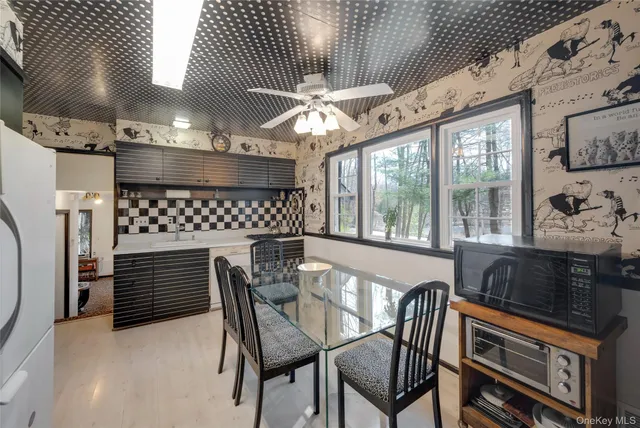 a dining room with furniture and window