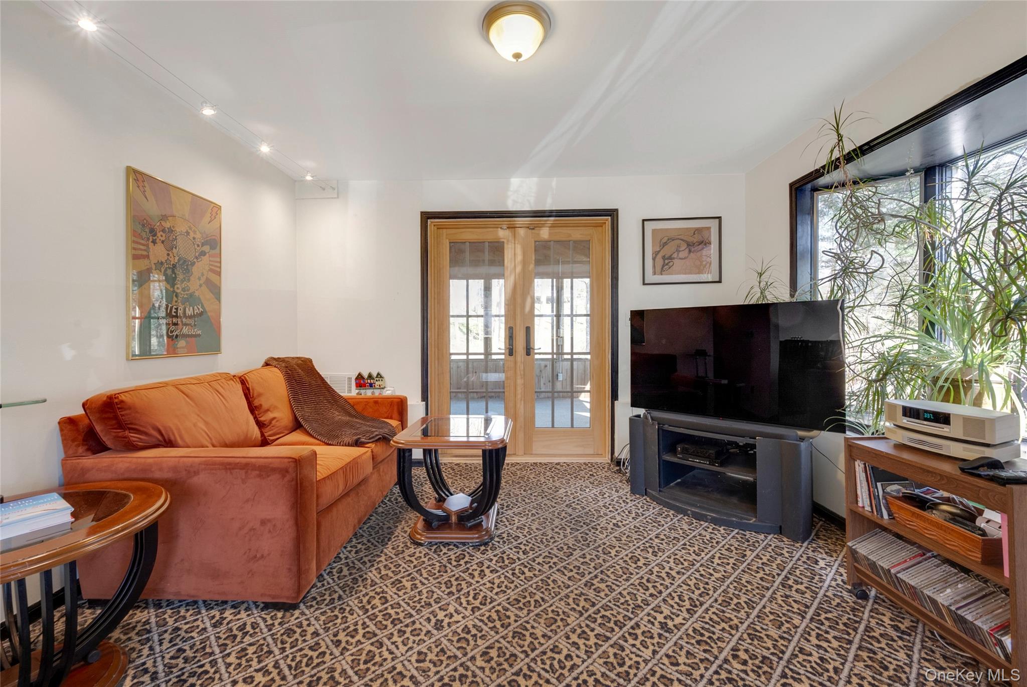 119 Goldens Bridge Road Katonah, NY 10536 - Photo 19 of 34 a living room with furniture and a flat screen tv