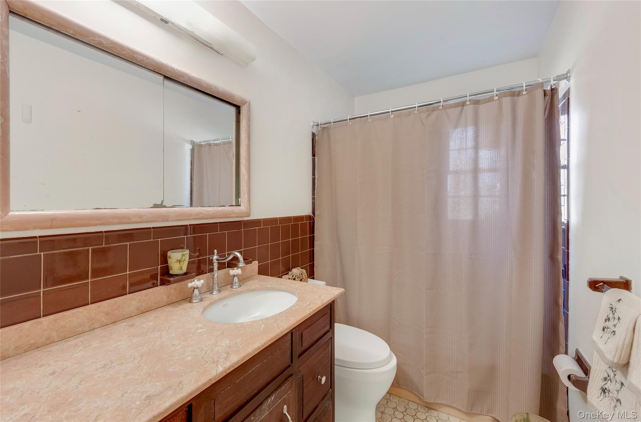 119 Goldens Bridge Road Katonah, NY 10536 - Photo 21 of 34 a bathroom with a sink toilet and shower