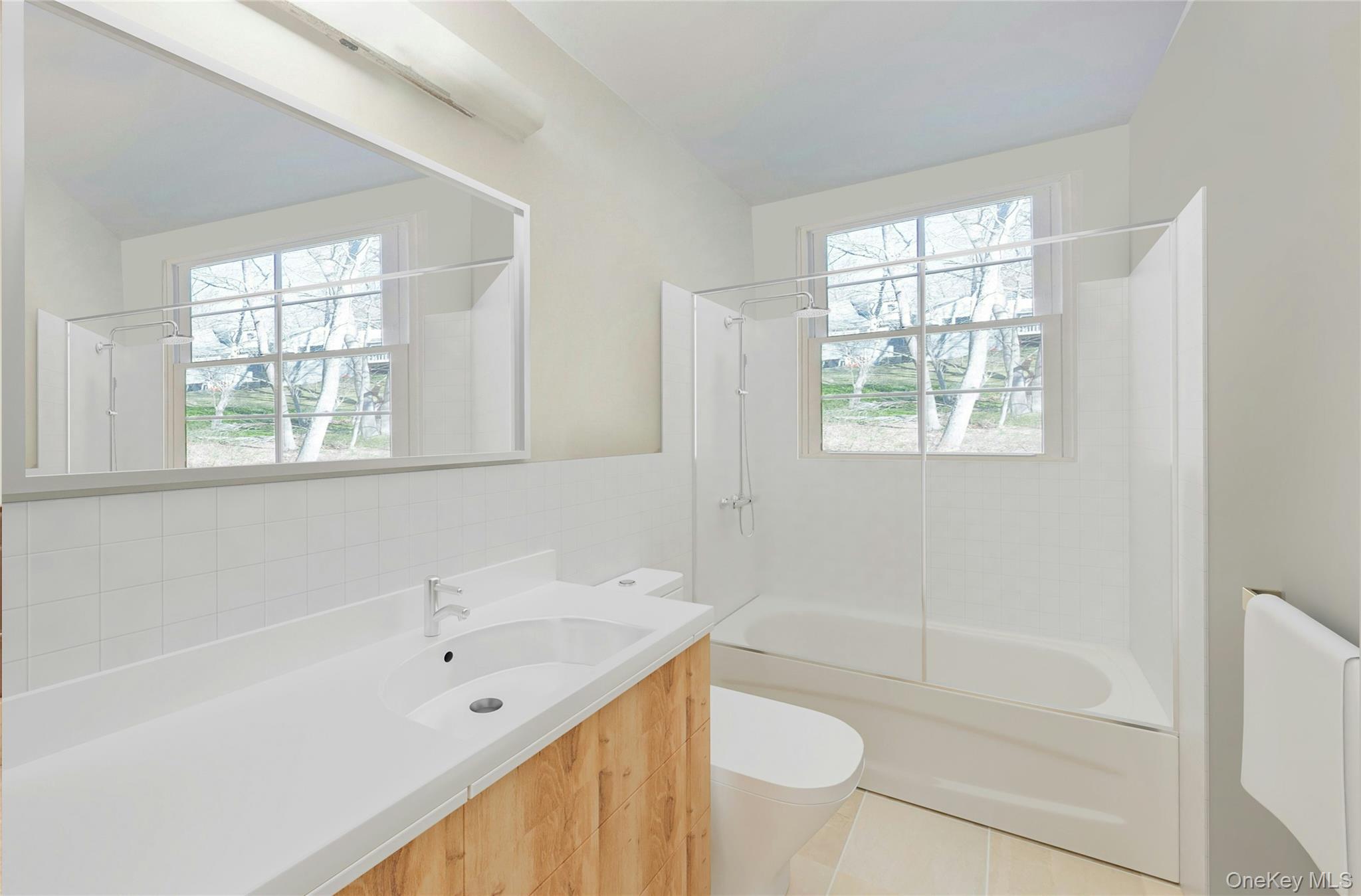 119 Goldens Bridge Road Katonah, NY 10536 - Photo 22 of 34 a bathroom with a bathtub sink and toilet