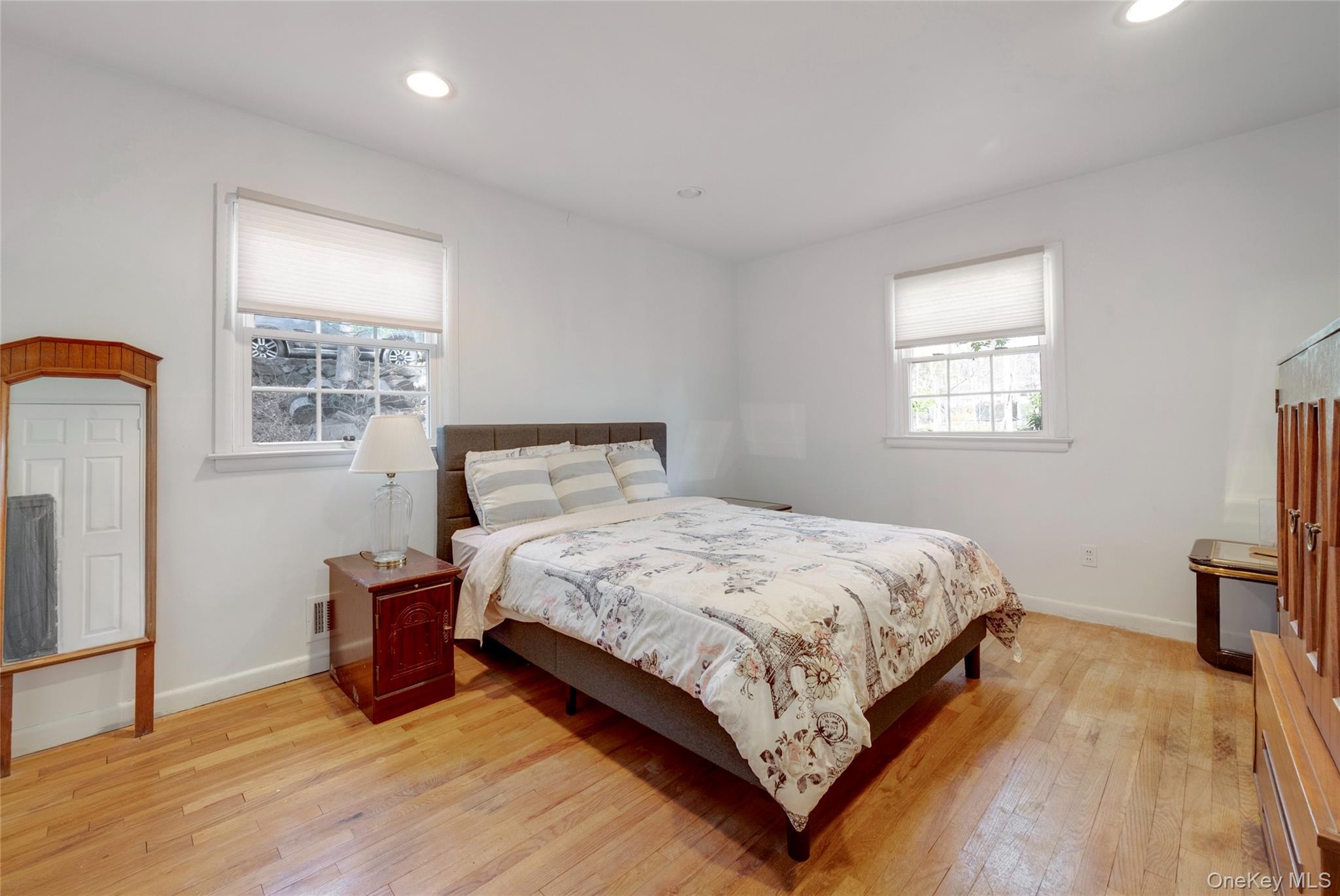119 Goldens Bridge Road Katonah, NY 10536 - Photo 23 of 34 a bedroom with a bed window and a flat tv screen